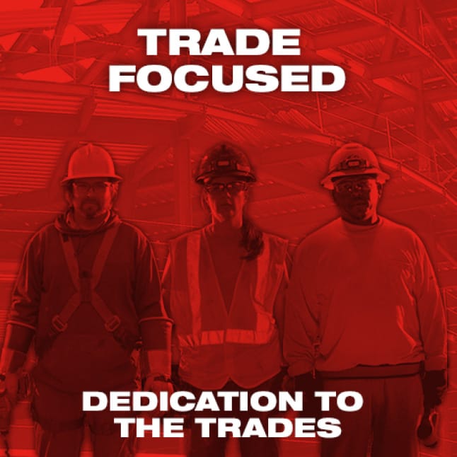 Three trade professionals in safety gear on red background
