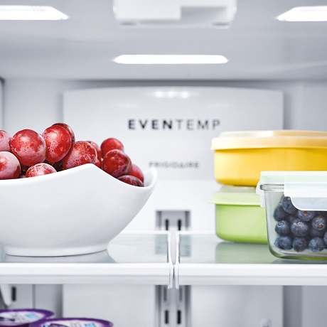 Fruits and berries inside refrigerator