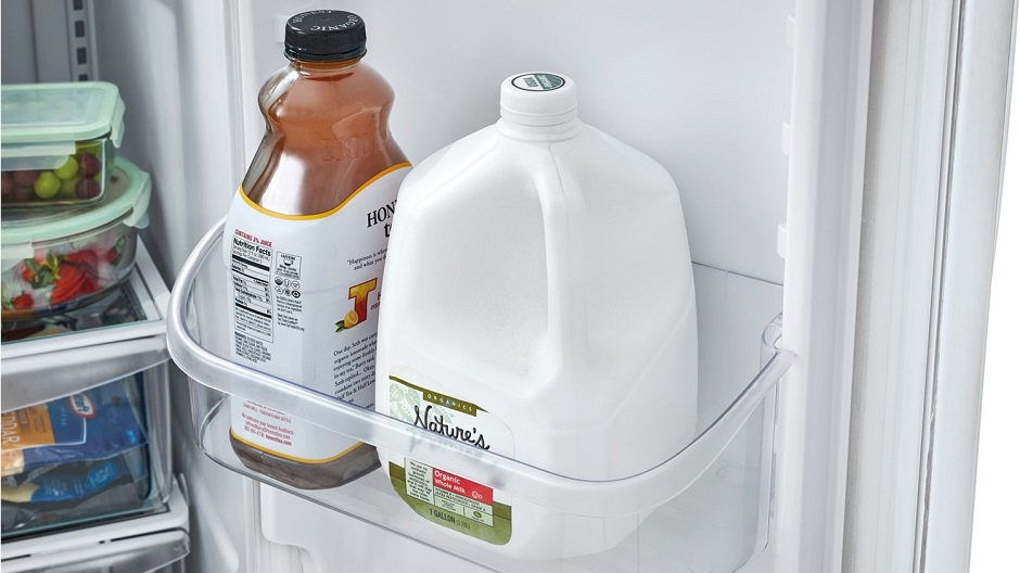 Gallon of milk in refrigerator door.