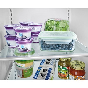 Food on glass shelves in refrigerator