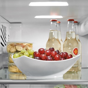 Food and drinks on top shelf of refrigerator