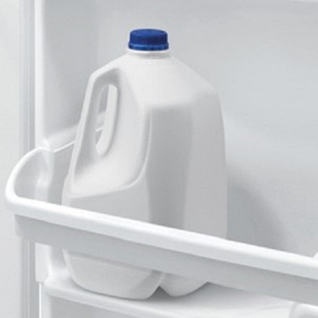 Gallon of milk in refrigerator door.