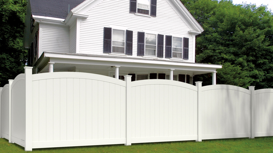The white Woodbridge arched privacy panel installed in a yard to show a corner installation and different angles of the fence. The white Woodbridge arched privacy panel installed in a yard to show a corner installation and different angles of the fence.