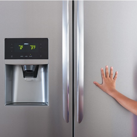 Hand touching refrigerator