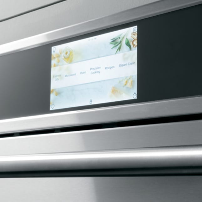 The wall LCD oven's screen shows a selection of options for cooking, baking, broiling, and more.