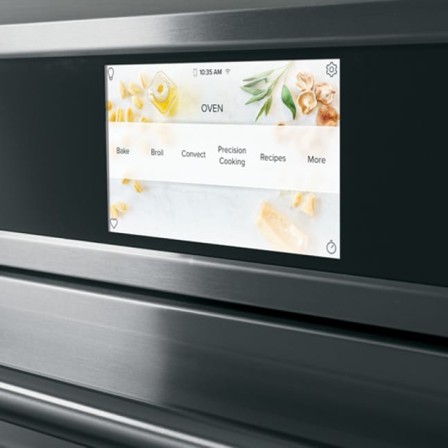 The wall oven's LCD screen shows a selection of options for cooking, baking, broiling, and more.