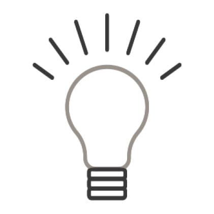 An icon of a light bulb.Rays of light shine from the bulb.