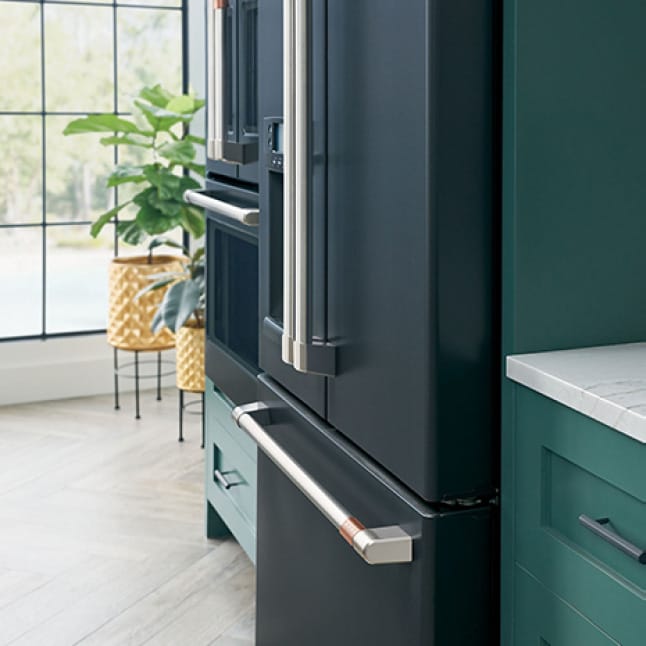 An installed fridge is flush with the surrounding cabinets, creating a seamless look.