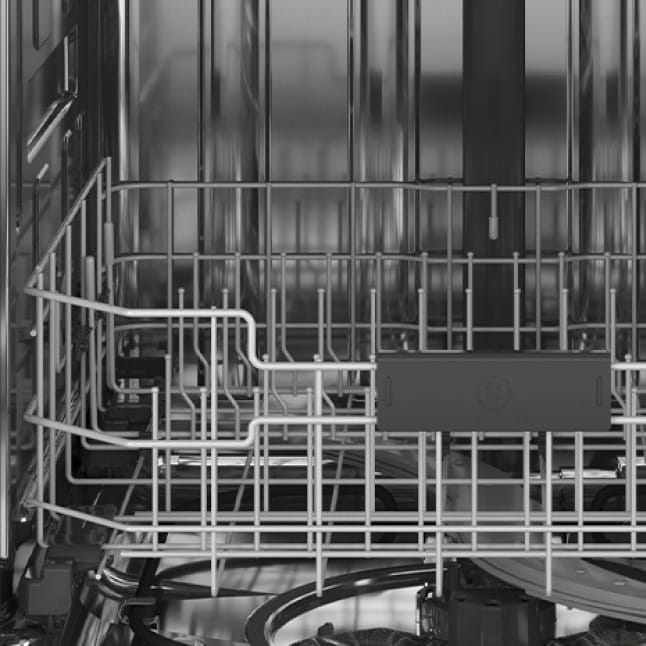 An interior shot of the dishwasher.The tines are showcased in the empty rack.