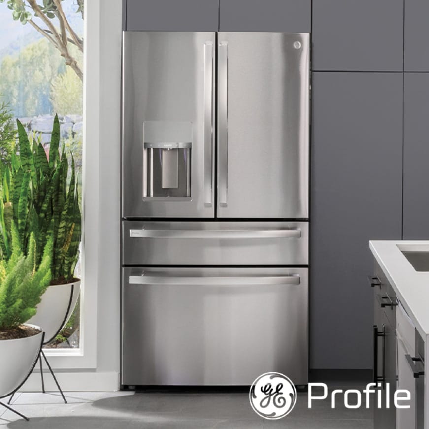 A front-facing view of the refrigerator's sleek stainless exterior in a stylish kitchen that compliments the finish.