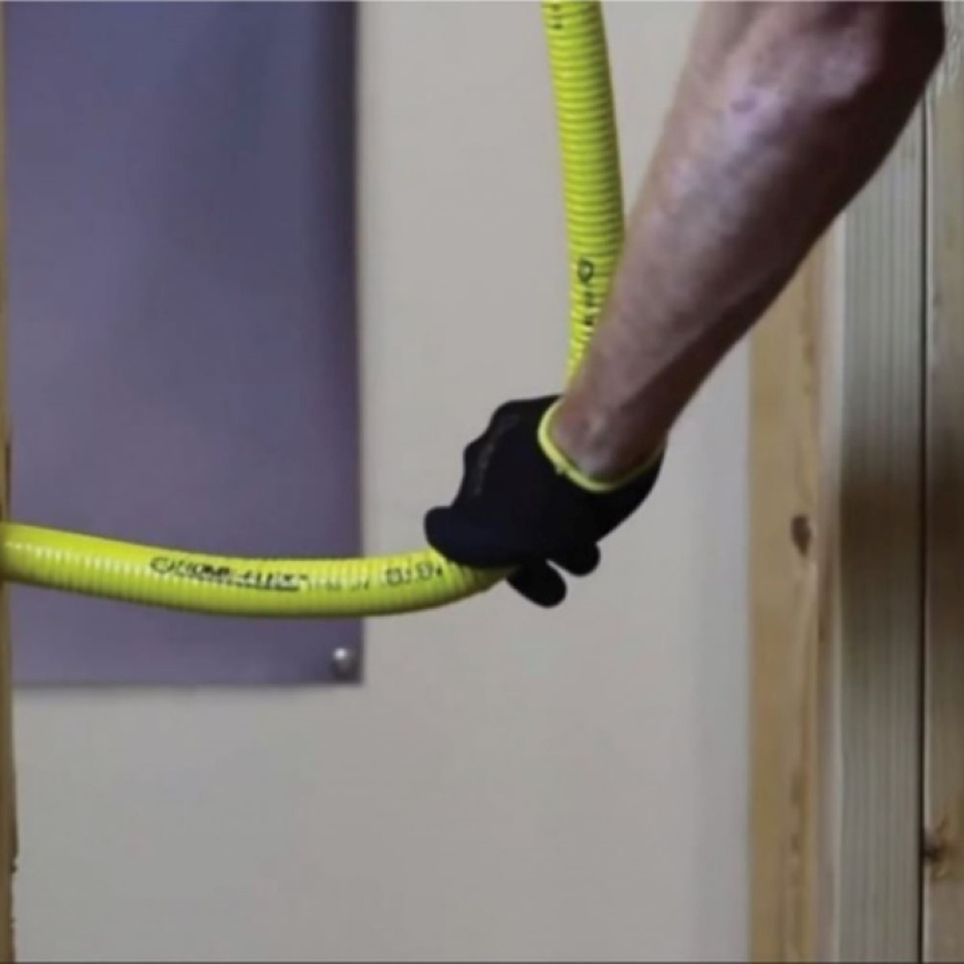 Image of hand holding a pipe that easily bends